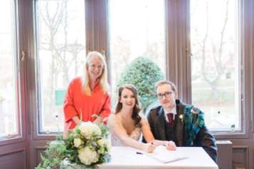 Kirsty and Adam sign on the dotted line at Devonshire Gardens.